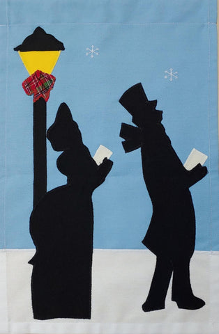 Carolers Silhouette Flag on Lt. Blue - 12 x 18 in